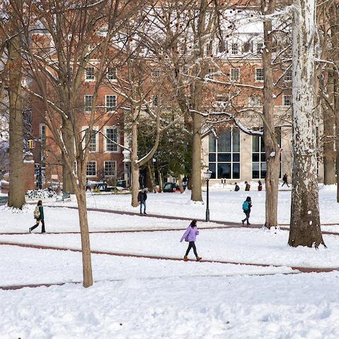 Ohio University students walk through a snowy campus